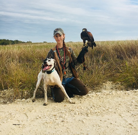 Mal with Finn and Allie Mallory Roelke with Harris's hawk and pointer
